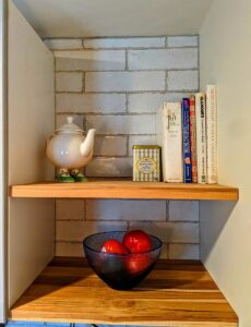 Wall tiles, with floating shelves.